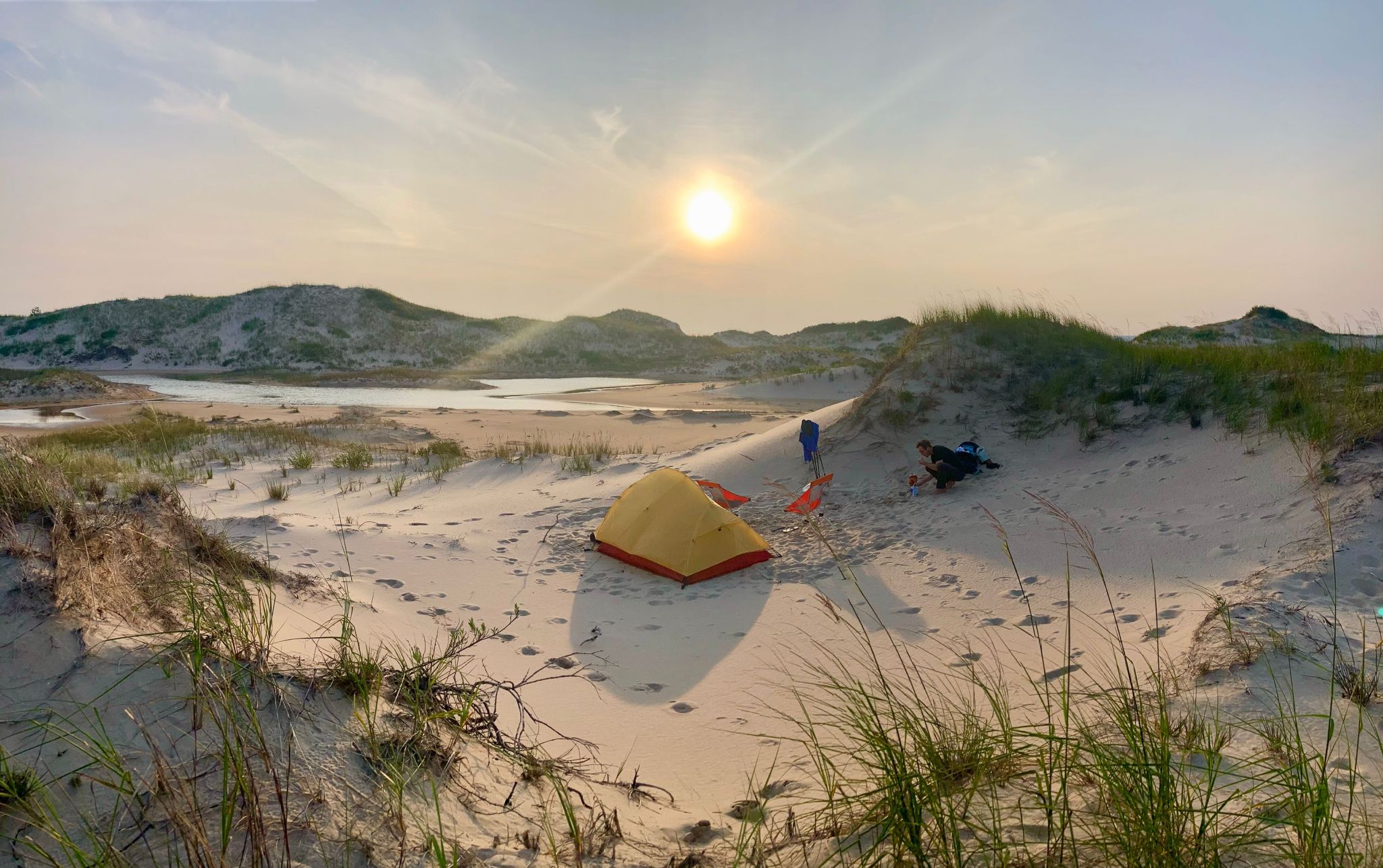 Kevin setting up a tent on the beach